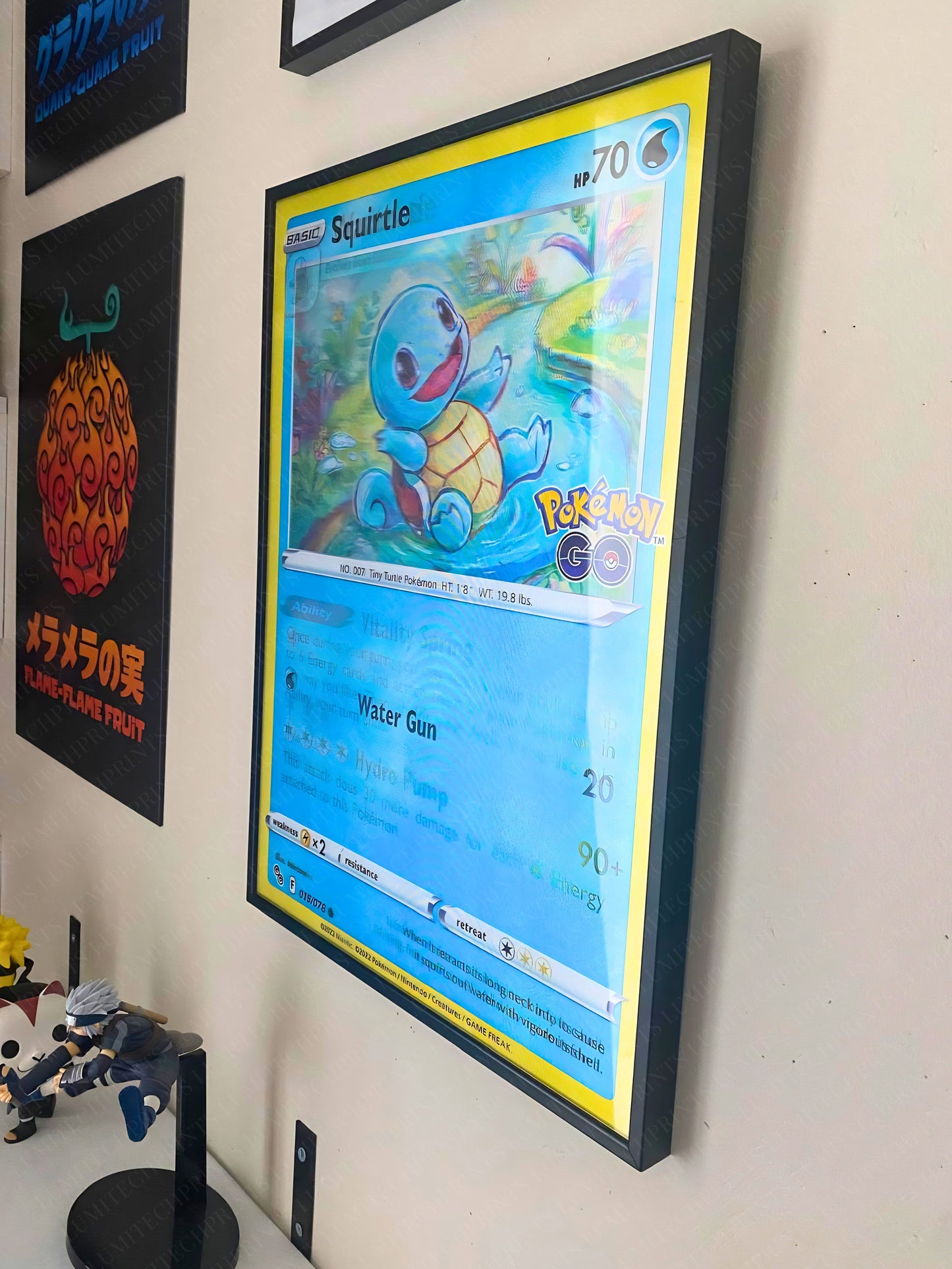 Pokemon Squirtle evolution 3D lenticular poster displayed on wall - gaming room decor